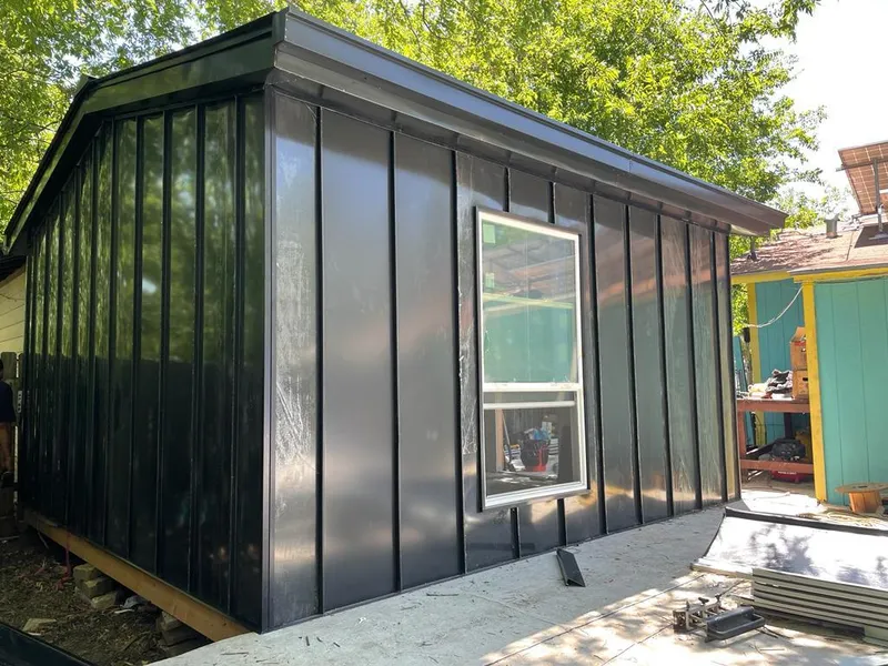 Black standing seam metal wall panels for Roof Inspection in Exeter
